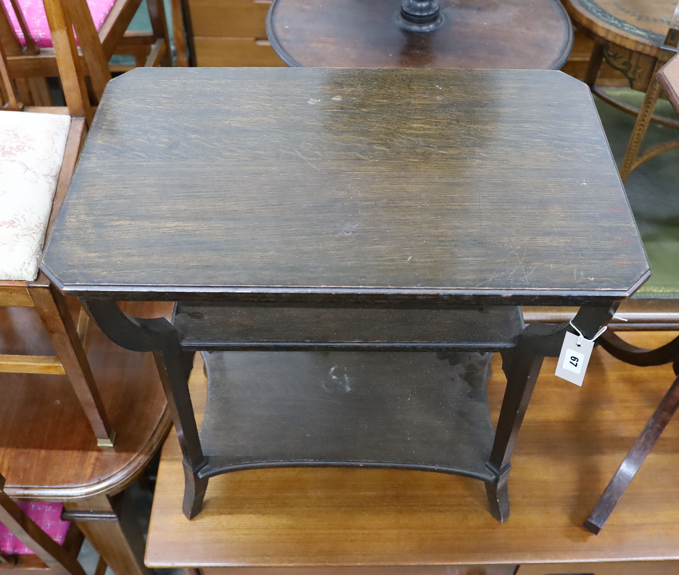 A Liberty's three tier rectangular oak occasional table, width 67cm, depth 42cm, height 69cm